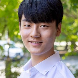 Professional headshot of a man. 