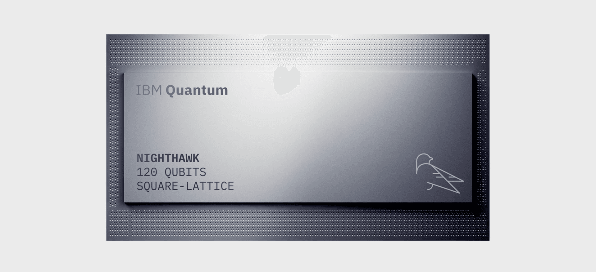 A sleek, metallic IBM Quantum Nighthawk processor chip against a light grey background. The face of the rectangular chip features the text "IBM Quantum", "NIGHTHAWK", "120 QUBITS", "SQUARE-LATTICE", and a minimalist line-art logo of a bird on the bottom right.