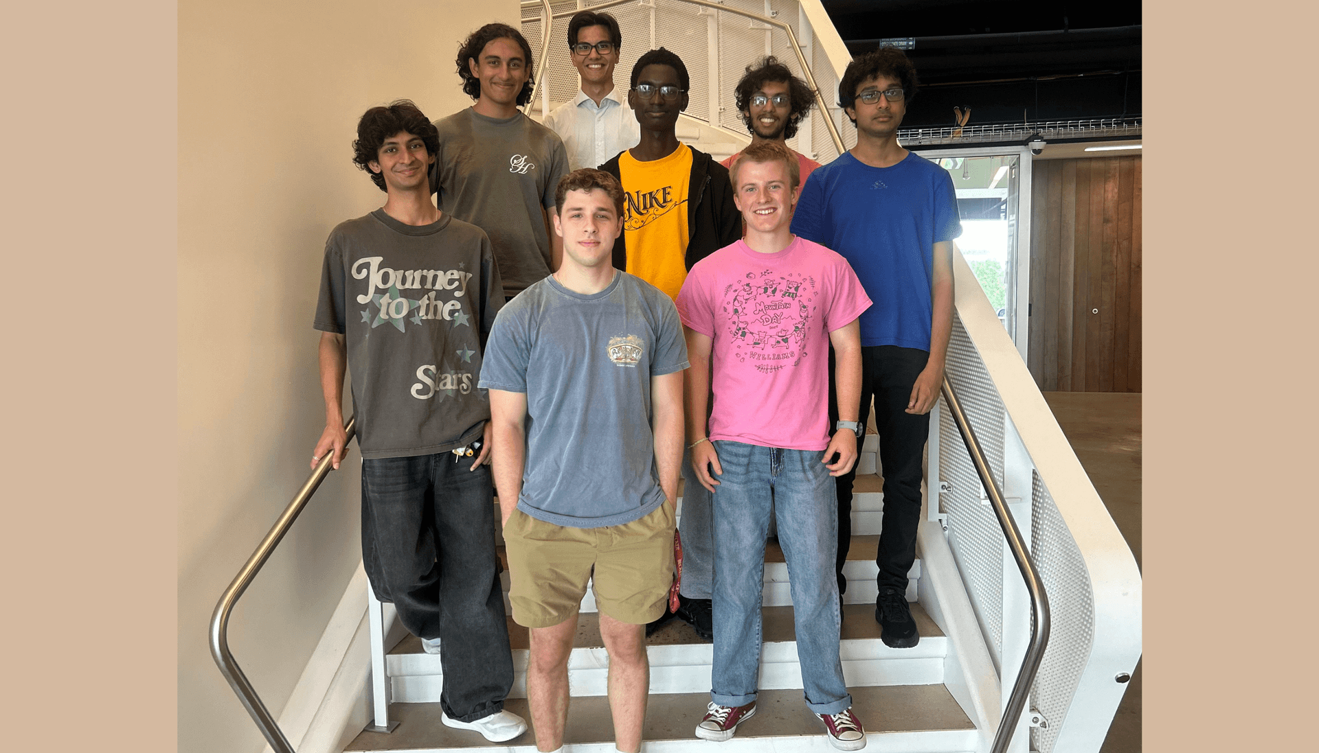 eight young men participating in the RQS REU summer 2026 program pose for the camera