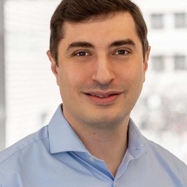 Professional headshot of a man. 