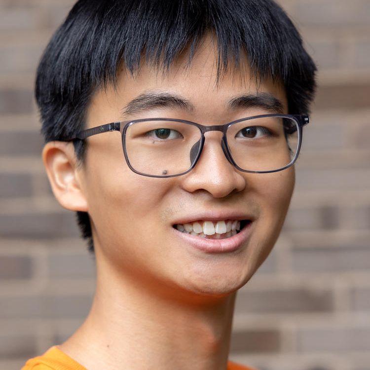 Professional headshot of a man. 