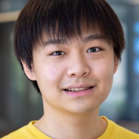 Professional headshot of a man. 